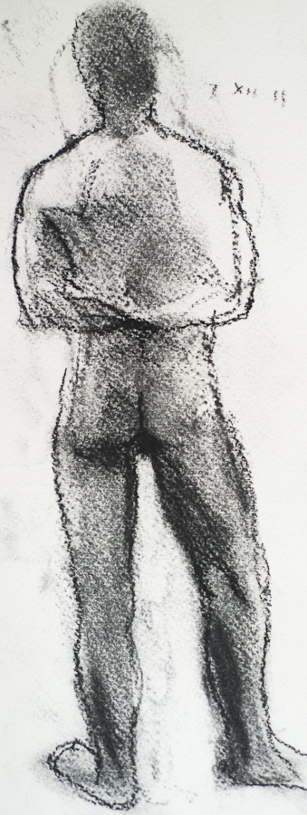 Darren Standing, arms crossed behind, rear view